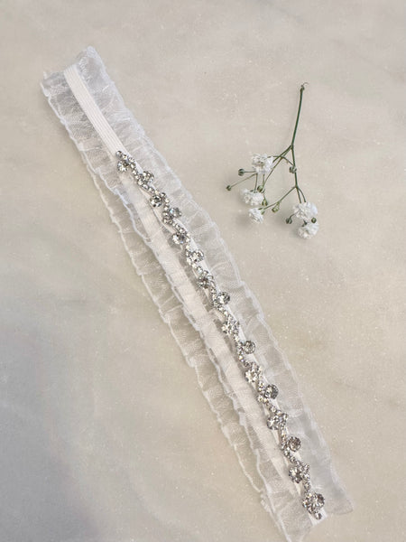 Strumpeband vitt med stenar strass