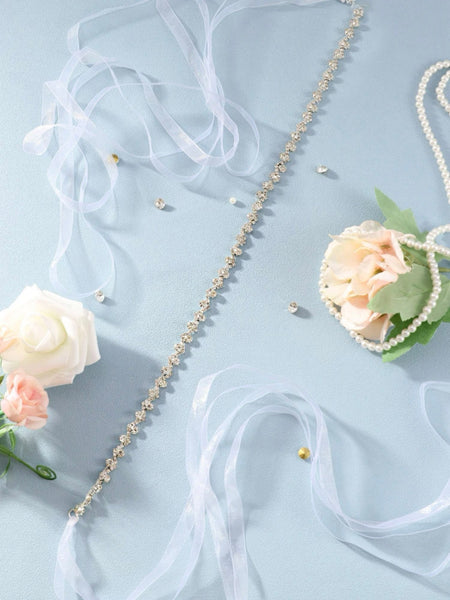 Midjeband i vit organza med stenar